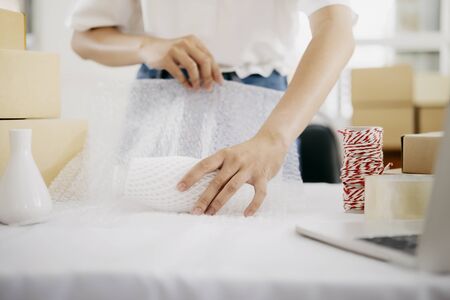 Online small business owner. Young startup entrepreneur online small business owner working at home,...