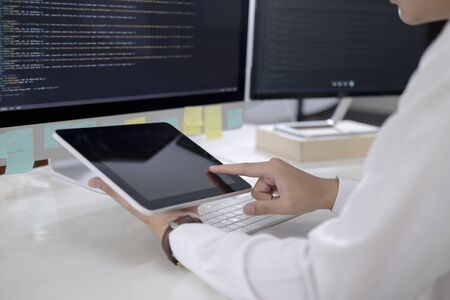 Programmer is coding and programming software. Software developer typing data code, working on...
