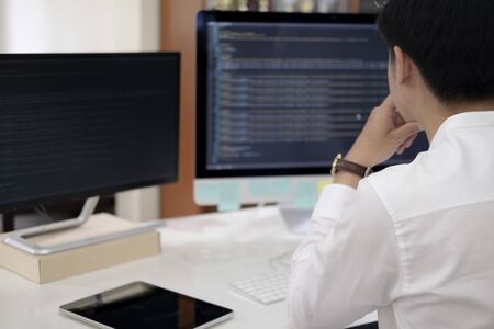 Programmer is coding and programming software. Software developer typing data code, working on...