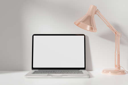 Workspace with mockup blank screen laptop computer. 3D Rendering.