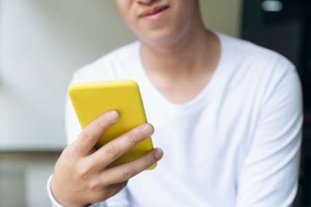 Close up of a man using mobile smart phone.