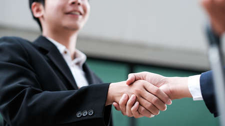 Businessmans handshake. Successful businessmen handshaking after good deal. Business partnership...