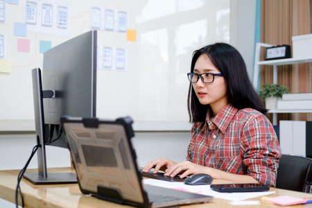 Programmers and developer teams are coding and developing softwareの写真素材