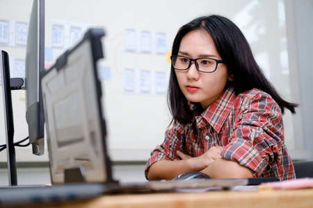 Programmers and developer teams are coding and developing softwareの写真素材