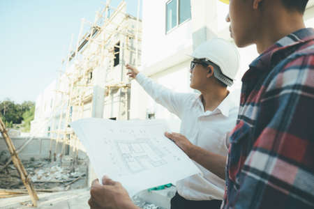 The engineering team working at building site meeting and discussing.