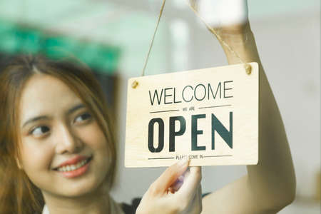 Close up Young business owner open the coffee shop.