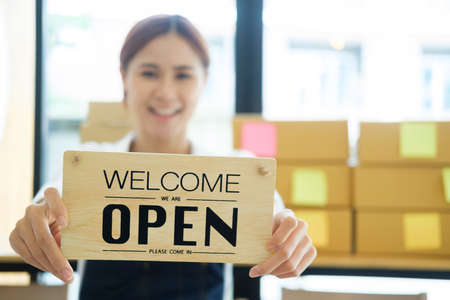 Close up Young business owner open the coffee shop.