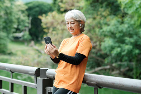Happy senior woman taking selfie photo.の写真素材