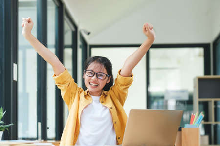 Enjoy young woman celebrate success or happy pose.