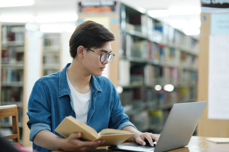 Student studying at library.の写真素材