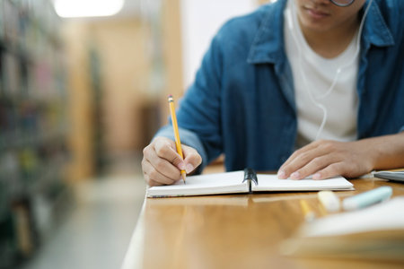 Student studying at library.の写真素材