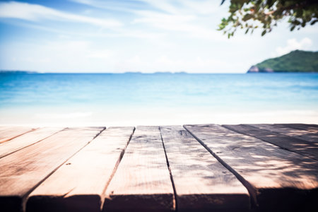 Top of wood table with seascape, blur calm sea and sky at tropical beach background. Empty table...