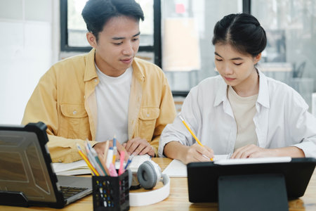 Young students campus helps friend catching up and learning.