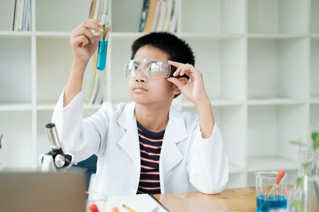 Young Scientists in Action: Kids Conduct Chemistry Experiment in School Laboratory