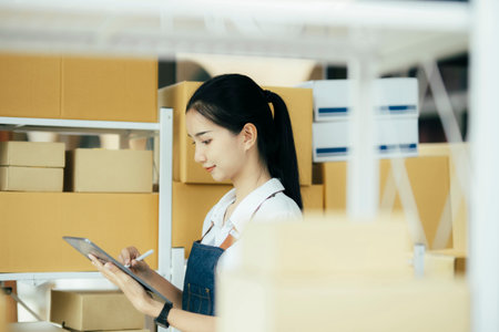 Checking stock for delivering products to customers.の写真素材