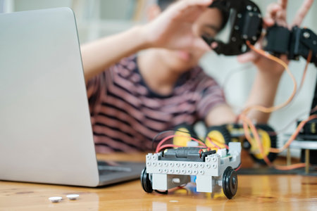 Student doing robot project in science technology of robotics programing and STEM education concept.