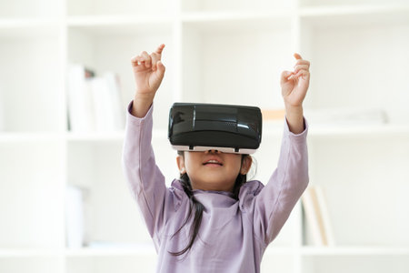 Child Delighted by Virtual Reality Experienceの写真素材
