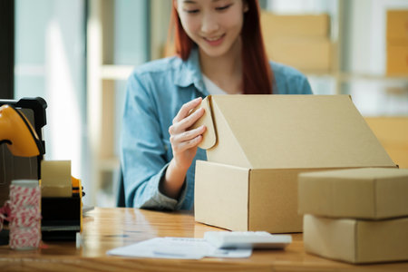 Small Business Owner Preparing Order for Shipmentの写真素材