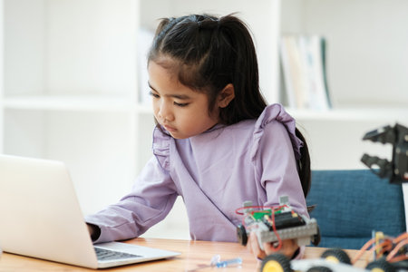 STEM education concept. Asian young girl learning robot design.の写真素材