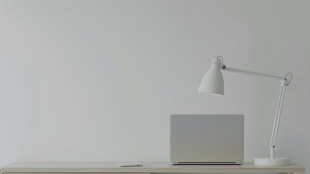 A sleek and modern home office setup featuring a white desk and laptop, with a lamp and notebook on a white wall, in the style of subtle minimalism The image is rendered in 3D and portrays a sense of focus and isolation, perfect for technology,の素材