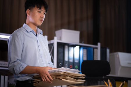 Businessman working overtime at his office He felt tired.の写真素材