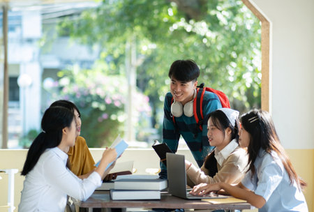 Group of students studying on campus outdoors