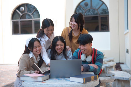 Group of students studying on campus outdoorsの写真素材