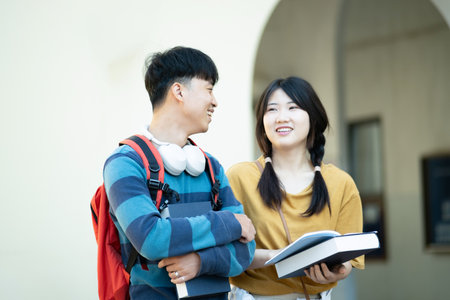 Students smiling while studying together on campus