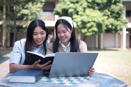 Group of students studying on campus outdoorsの写真素材