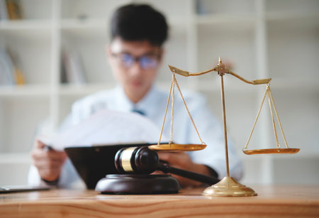 Lawyer Reviewing Legal Documents at Office Desk