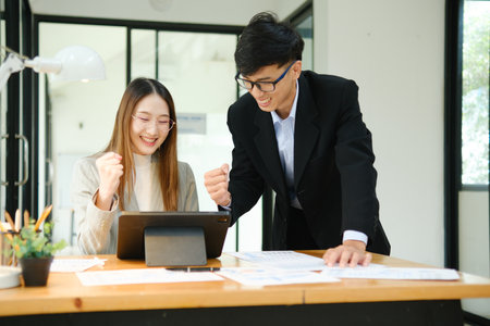 Young business entrepreneurs celebrating a successの写真素材