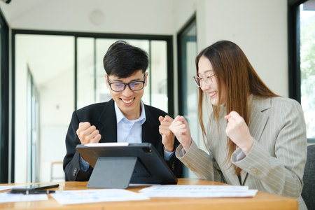 Young business entrepreneurs celebrating a successの写真素材