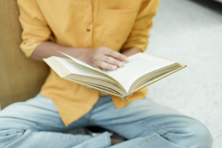 Student Of University Choosing Book and Reading Book In Library.の写真素材