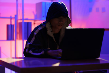 Hacker launching cyberattack targeting data systems and exposing cybersecurity vulnerabilities