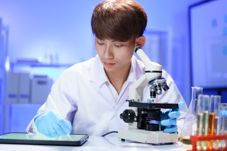 Scientist recording the results of the study in a laboratory journal.