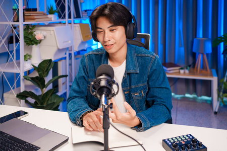 Man discussing podcast content with notesの写真素材