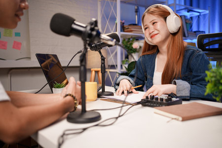 People in the podcast studio talking and recordingの写真素材