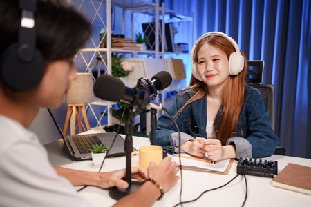 People in the podcast studio talking and recordingの写真素材