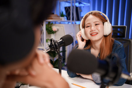 People in the podcast studio talking and recordingの写真素材