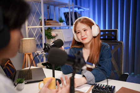 People in the podcast studio talking and recordingの写真素材