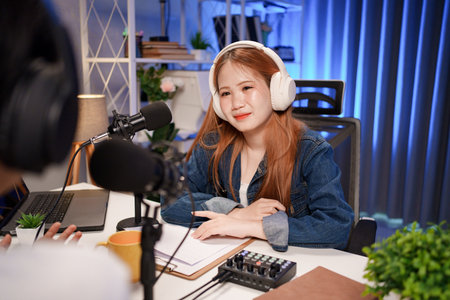 People in the podcast studio talking and recording