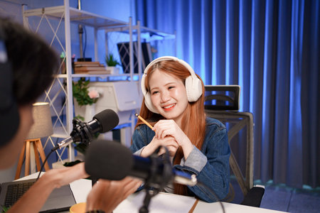 People in the podcast studio talking and recordingの写真素材