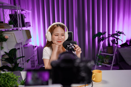 Podcast host recording professional audio for streaming broadcast and digital content creation in...