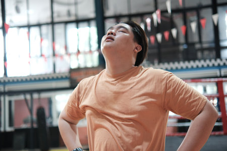 Fitness and determination. A man resting during his training.