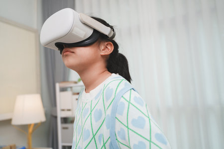 Asian girl amazed by VR headset experience. Immersive edutainment simulation.