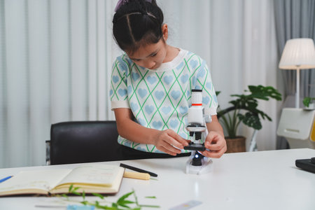 STEM focused student examining plant sample to build scientific thinking and future skillsの写真素材