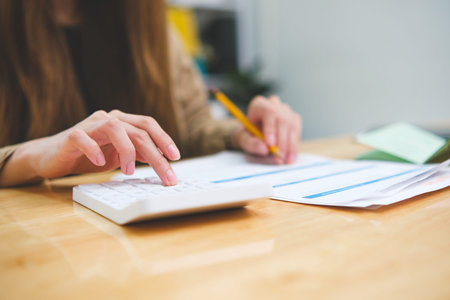 Businesswoman hands or finance with calculator or documents for project budget or expenses in...