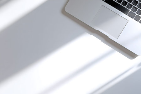 Laptop is on a table with a white background