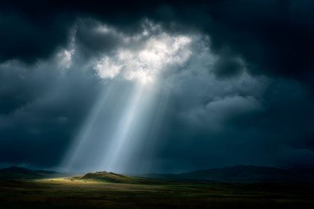 Field of grass with a bright sun shining through the clouds