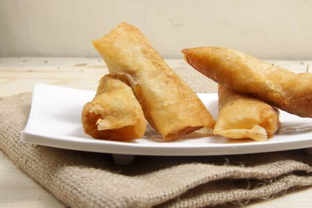 Group of rissoles on a white square plate, a delicious food